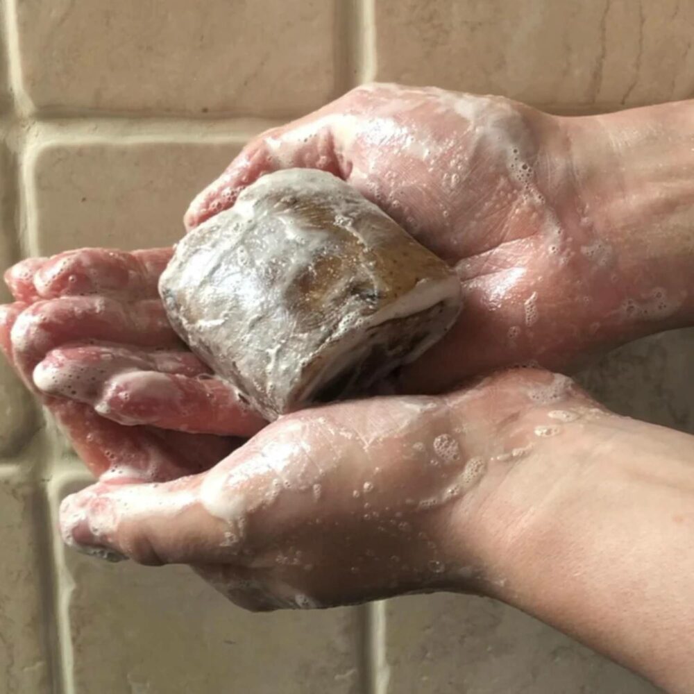 hands using African Shea Black Soap