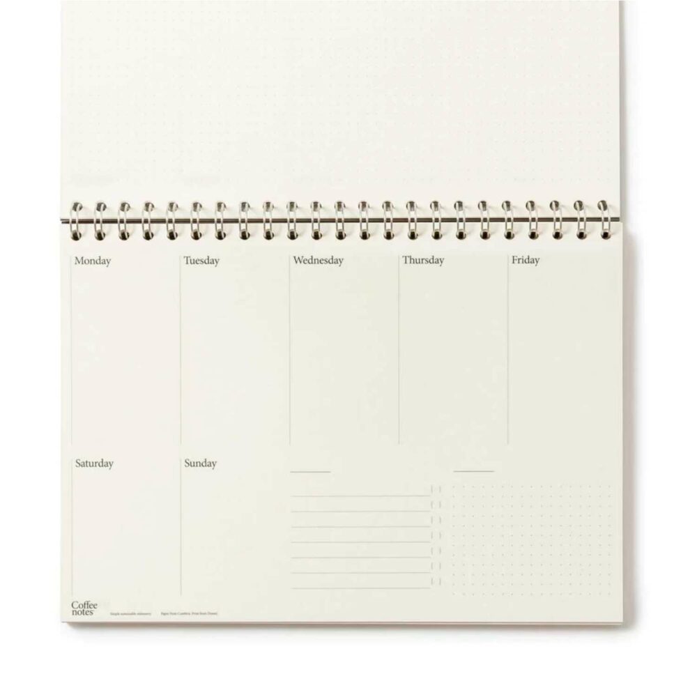 eco friendly 7 day planner open on desk