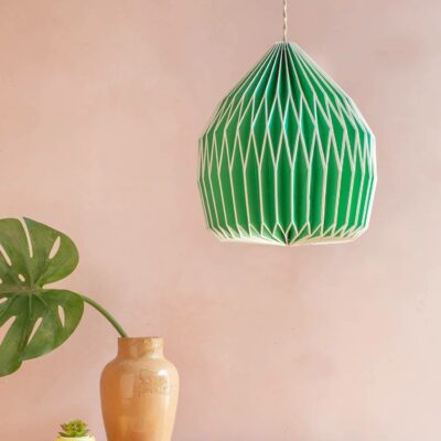Ian Snow Paper Pendant lampshade hanging above a houseplant