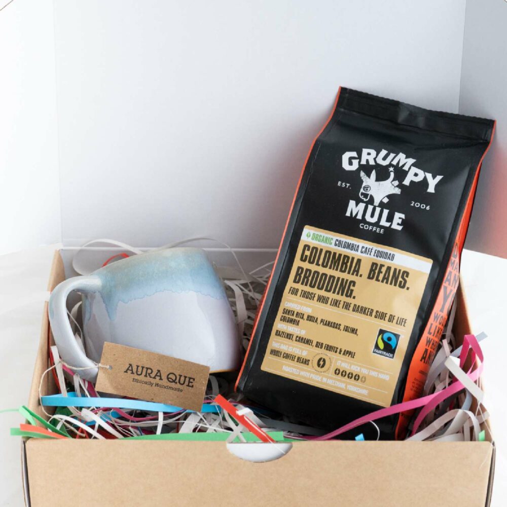 Open box showing coffee lovers hamper with mug and bag of coffee