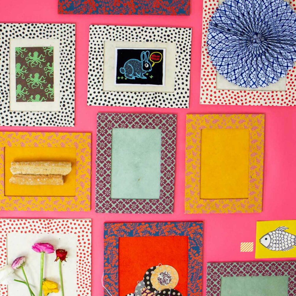 selection of afroart frames on pink wall